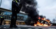 Dutch police clash with anti-curfew protesters, amid looting and vandalism