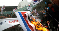 Kim Jong-un’s picture burned in protest against North Korea’s Olympic participation