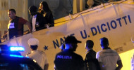 Migrants disembark coast guard ship in Sicily after reports of violence