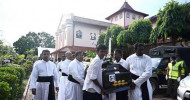 Srilanka:IS claims responsibility for SL bombings,People carry a casket during a mass for victims, two days after a string of suicide bomb attacks on churches and luxury hotels across the island on Easter Sunday, in Negombo (Reuters)