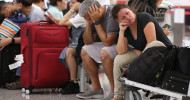 Stranded passengers at Hong Kong International Airport left to fend for themselves not knowing when they will be able to escape protest-hit city